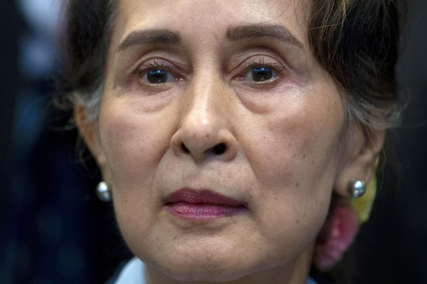 In this Dec. 11, 2019, file photo, Myanmar&#39;s leader Aung San Suu Kyi waits to address judges of the International Court of Justice in The Hague, Netherlands. The army takeover in Myanmar a year ago that ousted the elected government of Aung San Suu Kyi brought a shocking end to the effort to restore democratic rule in the Southeast Asian country after decades of military rule. But at least as surprising has been the level of popular resistance to the seizure of power, which has blossomed into an insurgency that raises the specter of a protracted civil war. (AP Photo/Peter Dejong, File)