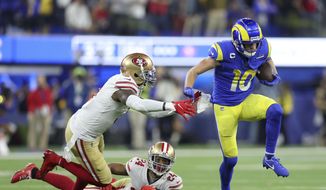 Los Angeles Rams&#39; Cooper Kupp (10) gets past San Francisco 49ers&#39; Jaquiski Tartt, left, and K&#39;Waun Williams (24) during the second half of the NFC Championship NFL football game Sunday, Jan. 30, 2022, in Inglewood, Calif. (AP Photo/Jed Jacobsohn)