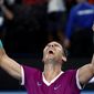 Rafael Nadal of Spain celebrates his win over Daniil Medvedev of Russia in the men&#39;s singles final at the Australian Open tennis championships in Melbourne, Australia, early Monday, Jan. 31, 2022. (AP Photo/Hamish Blair)