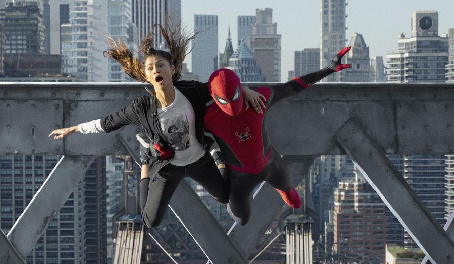 This image released by Sony Pictures shows Zendaya, left, and Tom Holland in Columbia Pictures&#39; &amp;quot;Spider-Man: No Way Home.&amp;quot; (Sony Pictures via AP)