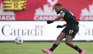Canada&#39;s Cyle Larin scores against the United States during the first half of a World Cup soccer qualifier in Hamilton, Ontario, Sunday, Jan. 30, 2022. (Nathan Denette/The Canadian Press via AP)