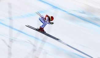 FILE - United States&#39; Mikaela Shiffrin competes in the women&#39;s combined downhill at the 2018 Winter Olympics in Jeongseon, South Korea, Feb. 22, 2018. Winter Olympians in outdoor sports such as Alpine skiing or snowboarding say the weather can be a key factor in success or failure. (AP Photo/Alessandro Trovati, File)