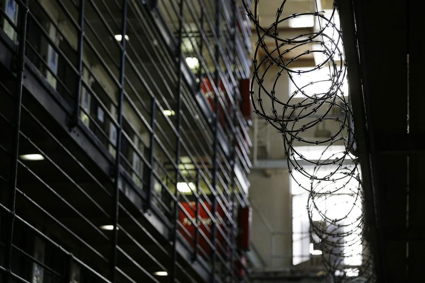 Barbed wire is seen inside the east block of death row at San Quentin State Prison Tuesday, Aug. 16, 2016, in San Quentin, Calif. California Gov. Gavin Newsom is moving to dismantle the nation&#39;s largest death row by moving all condemned inmates to other prisons with in two years. The goal is to turn the section of San Quentin State Prison into &amp;quot;a positive, healing environment.&amp;quot; (AP Photo/Eric Risberg, File)