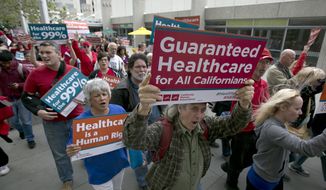 FILE - Supporters of single-payer health care march to the Capitol, Wednesday, April 26, 2017, in Sacramento, Calif. On Monday, Jan. 31, 2022, California Democrats face a deadline to advance a bill that would create a government-funded universal health care system. The proposal has the support of some Democratic leaders and powerful labor union, but it faces strong opposition from business groups who say it would cost too much. (AP Photo/Rich Pedroncelli, File)