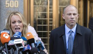 In this file photo, adult film actress Stormy Daniels, left, speaks as her lawyer Michael Avenatti listens outside federal court, Monday, April 16, 2018, in New York. Daniels has taken her star turn on the witness stand at California lawyer Michael Avenatti&#39;s trial, telling a jury Thursday, Jan. 27, 2022, he stole from her and lied to her. (AP Photo/Mary Altaffer, File)  **FILE**