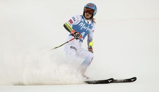 FILE - United States&#39; Mikaela Shiffrin checks her time at the finish area of an alpine ski, women&#39;s World Cup giant slalom, in Kronplatz, Italy, Jan. 25, 2022. Empathizing with other athletes’ frank conversations about mental health got Shiffrin thinking about what awaits her at the Beijing Olympics. (AP Photo/Gabriele Facciotti, File)