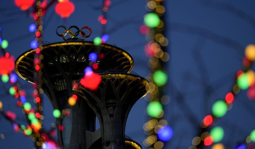 The Olympic rings sit on the top of the Beijing Olympic Tower ahead of the 2022 Winter Olympics, Tuesday, Feb. 1, 2022, in Beijing. (AP Photo/Natacha Pisarenko)