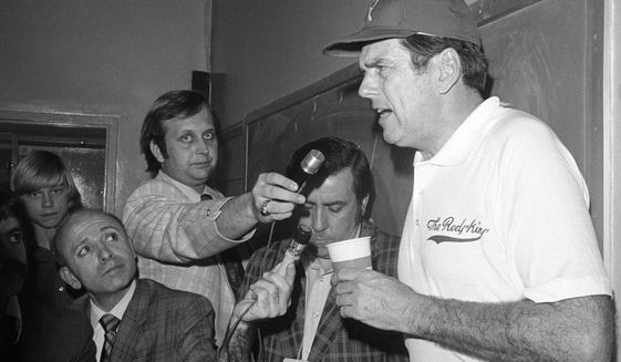 FILE - Washington Redskins coach George Allen, right, talks to newsmen Jan. 14, 1973, after his team was defeated by the Miami Dolphins in the NFL football Super Bowl in Los Angeles. (AP Photo, File)