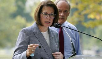 Sen. Catherine Cortez Masto, D-Nev., left, speaks alongside Sen. Tom Carper, D-Del., at a news conference to advocate for additional investments in zero-emission school buses on Capitol Hill in Washington, Sept.14, 2021. Cortez Masto raised $3.3 million the last three months of 2021 in her bid for reelection in the swing-state of Nevada, more than twice as much as either of the leading candidates seeking the Republican nomination to try to unseat her. (AP Photo/Patrick Semansky, File)