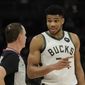 Milwaukee Bucks&#39; Giannis Antetokounmpo talks with an official during the first half of an NBA basketball game against the Washington Wizards Tuesday, Feb. 1, 2022, in Milwaukee. (AP Photo/Aaron Gash)