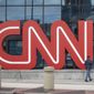 The CNN logo is displayed at the entrance to the CNN Center in Atlanta on Wednesday, Feb. 2, 2022. CNN President Jeff Zucker has abruptly resigned Wednesday after acknowledging a consensual relationship with another network executive. (AP Photo/Ron Harris)