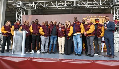 Team alums and Co-Owners Dan and Tanya Snyder pose at the Washington Commanders team name and logo reveal event at FedEx Field on February 2nd 2022 in Landover MD. (Reggie Hildred/All-Pro Reels)