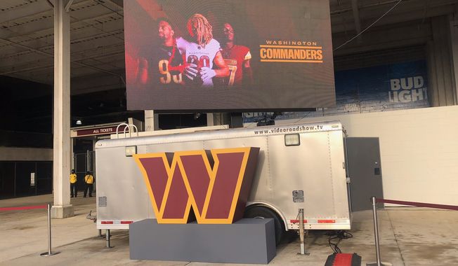 The new Commanders logo: A stylized burgundy and gold &quot;W.&quot; Matt Paras photo.