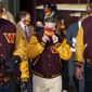 Dan Snyder, center, co-owner and co-CEO of the Washington Commanders, adjusts his mask as he arrives to unveil his NFL football team&#39;s new identity, Wednesday, Feb. 2, 2022, in Landover, Md. The new name comes 18 months after the once-storied franchise dropped its old moniker following decades of criticism that it was offensive to Native Americans. (AP Photo/Patrick Semansky) ** FILE**