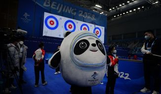 Bing Dwen Dwen, the Beijing Winter Olympics mascot practices at the Curling venue ahead of the Beijing Winter Olympics Wednesday, Feb. 2, 2022, in Beijing. (AP Photo/Brynn Anderson)