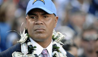 Late NFL star Junior Seau attends his induction into the San Diego Chargers Hall of Fame in San Diego on Nov. 27, 2011. The San Diego Union-Tribune reported that Seau&#x27;s brother, Savaii Seau was killed in a collision with a dump truck in the the San Diego suburb of Lakeside, on Tuesday, Feb. 1, 2022. Junior Seau was found dead in 2012 from a gunshot wound to his chest. (AP Photo/Denis Poroy, file)