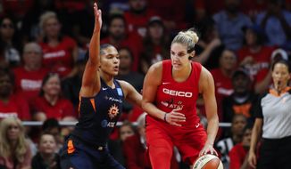 Washington Mystics forward Elena Delle Donne, right, drives against Connecticut Sun forward Alyssa Thomas during the first half of Game 5 of basketball&#39;s WNBA Finals, Oct. 10, 2019, in Washington. Delle Donne is ready to play again. The two-time WNBA MVP has only been able to play three games the last two seasons because of back issues that required surgery and potential complications if she got the coronavirus. “I’ll be ready. I feel phenomenal. I have been going to work every single day,&amp;quot; Delle Donne said Tuesday, Feb. 1. (AP Photo/Alex Brandon, File) **FILE**