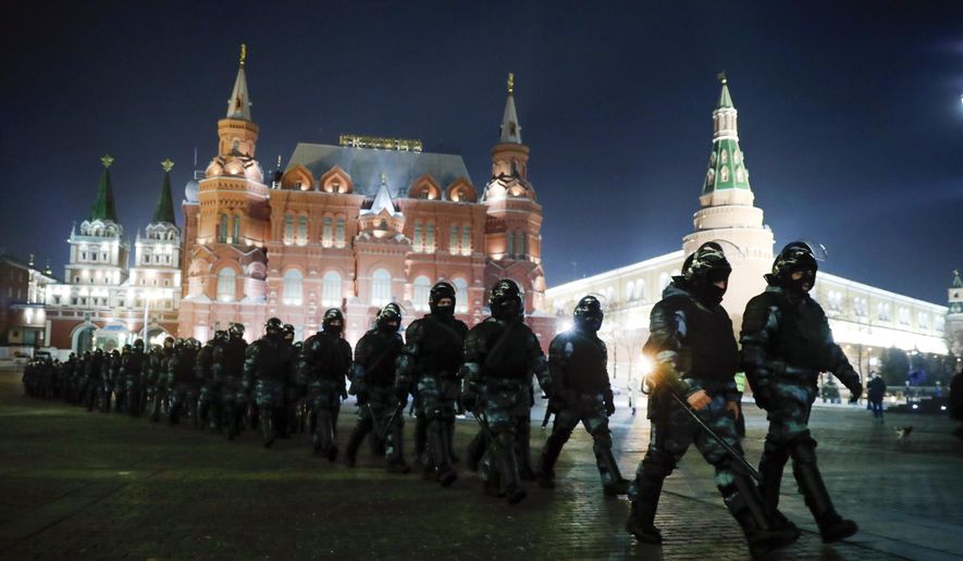 FILE - Servicemen of the Russian National Guard (Rosgvardia) gather at Red Square to prevent a protest rally in Moscow, Russia, Tuesday, Feb. 2, 2021. In pressure unprecedented in post-Soviet Russia, since the imprisonment of Alexei Navalny, scores of activists, independent journalists and rights advocates have been targeted with raids, detentions and designations as terrorists and foreign agents. (AP Photo/Pavel Golovkin, File)