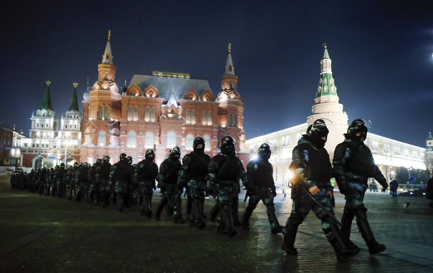 FILE - Servicemen of the Russian National Guard (Rosgvardia) gather at Red Square to prevent a protest rally in Moscow, Russia, Tuesday, Feb. 2, 2021. In pressure unprecedented in post-Soviet Russia, since the imprisonment of Alexei Navalny, scores of activists, independent journalists and rights advocates have been targeted with raids, detentions and designations as terrorists and foreign agents. (AP Photo/Pavel Golovkin, File)