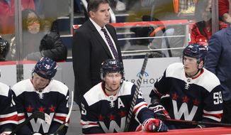 Washington Capitals head coach Peter Laviolette looks on during the third period of an NHL hockey game against the Edmonton Oilers, Wednesday, Feb. 2, 2022, in Washington. The Oilers won 5-3. (AP Photo/Nick Wass)