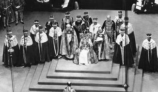 Surrounded by peers and churchmen, Queen Elizabeth II sits on throne in Westminister Abbey, London, June 2, 1953 after her coronation. Britain is marking Queen Elizabeth II&#x27;s Platinum Jubilee on Sunday, Feb. 6, 2022, 70 years after she ascended to the throne. (AP Photo, File)
