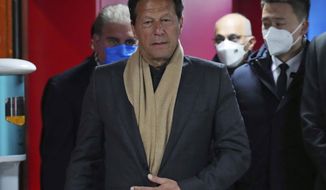 Pakistan&#39;s Prime Minister Imran Khan arrives for the opening ceremony of the 2022 Winter Olympics, Friday, Feb. 4, 2022, in Beijing. (Carl Court/Pool Photo via AP)