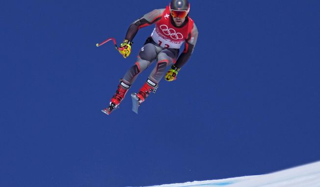 Aleksander Aamodt Kilde, of Norway makes a jump during a men&#x27;s downhill training run at the 2022 Winter Olympics, Thursday, Feb. 3, 2022, in the Yanqing district of Beijing. (AP Photo/Robert F. Bukaty)