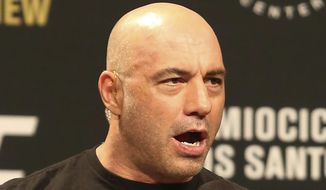 Joe Rogan is seen during a weigh-in before UFC 211 on Friday, May 12, 2017, in Dallas before UFC 211.  Spotify’s popular U.S. podcaster has apologized after a video compilation surfaced that showed him using racial slurs in clips of episodes over a 12-year span. In a video posted on his Instagram account on Saturday, Feb. 5, 2022, Rogan who hosts a podcast called “The Joe Rogan Experience,” said his use of the slurs was the “most regretful and shameful thing that I’ve ever had to talk about publicly.”  ( AP Photo/Gregory Payan, File)
