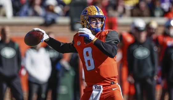 National Team quarterback Kenny Pickett, of Pittsburgh, throws a pass during the first half of an NCAA Senior Bowl college football game, Saturday, Feb. 5, 2022, in Mobile, Ala. (AP Photo/Butch Dill) **FILE**