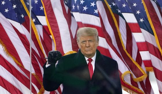 Then-President Donald Trump gestures as he arrives to speak at a rally in Washington, on Jan. 6, 2021.  (AP Photo/Jacquelyn Martin, File)