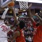 Ohio State&#39;s E.J. Liddell, left, shoots over Maryland&#39;s Donta Scott, center, and Qudus Wahab during the second half of an NCAA college basketball game, Sunday, Feb. 6, 2022, in Columbus, Ohio. (AP Photo/Jay LaPrete)