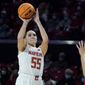 Maryland forward Chloe Bibby (55) shoots a basket against Nebraska guard Jaz Shelley during the first half of an NCAA college basketball game, Sunday, Feb. 6, 2022, in College Park, Md. (AP Photo/Julio Cortez) **FILE**