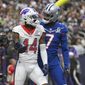 AFC wide receiver Stefon Diggs (14), of the Buffalo Bills, reacts with NFC cornerback Trevon Diggs, right, of the Dallas Cowboys, after scoring a touchdown during the second half of the Pro Bowl NFL football game, Sunday, Feb. 6, 2022, in Las Vegas. (AP Photo/David Becker) **FILE**