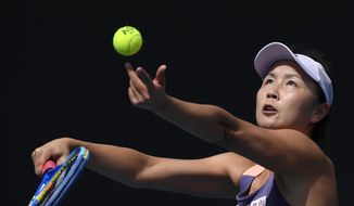 China&#39;s Peng Shuai serves to Japan&#39;s Nao Hibino during their first round singles match at the Australian Open tennis championship in Melbourne, Australia, on Jan. 21, 2020. (AP Photo/Andy Brownbill, File) **FILE**