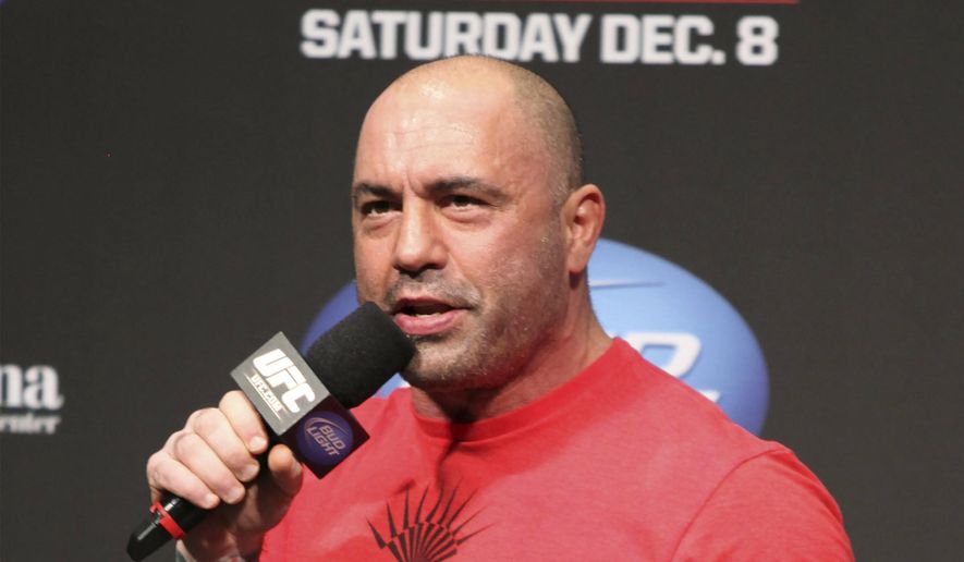 UFC announcer and podcaster Joe Rogan speaks at the weigh-in before a UFC on FOX 5 event in Seattle, on Dec. 7, 2012. (AP Photo/Gregory Payan, File)