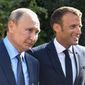 French President Emmanuel Macron, right, welcomes Russian President Vladimir Putin at the Fort of Bregancon in Bormes-les-Mimosas, southern France, Monday, Aug. 19, 2019. Rarely in recent years has the Kremlin been so popular with European visitors. Macron arrives Monday, Feb. 7, 2022. The Hungarian prime minister visited last week. And in days to come, the German chancellor will be there, too. (Gerard Julien, Pool via AP, File)