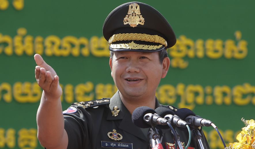 Son of Cambodian Prime Minister Hun Sen, Lt. Gen. Hun Manet delivers a speech while presiding over a military equipment delivery ceremony at the National Olympic Stadium in Phnom Penh, Cambodia, Thursday, June 18, 2020. Cambodia’s long-serving Prime Minister Hun Sen on Thursday, Dec. 2, 2021, explicitly declared his support to have his eldest son, army commander Hun Manet, eventually succeed him as the nation&#x27;s leader. (AP Photo/Heng Sinith)