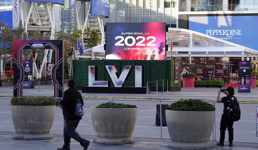 A Super Bowl display is placed at L.A. Live, Monday, Feb. 7, 2022, in Los Angeles. The Los Angeles Rams play the Cincinnati Bengals in the Super Bowl NFL Football game Feb. 13. (AP Photo/Marcio Jose Sanchez)
