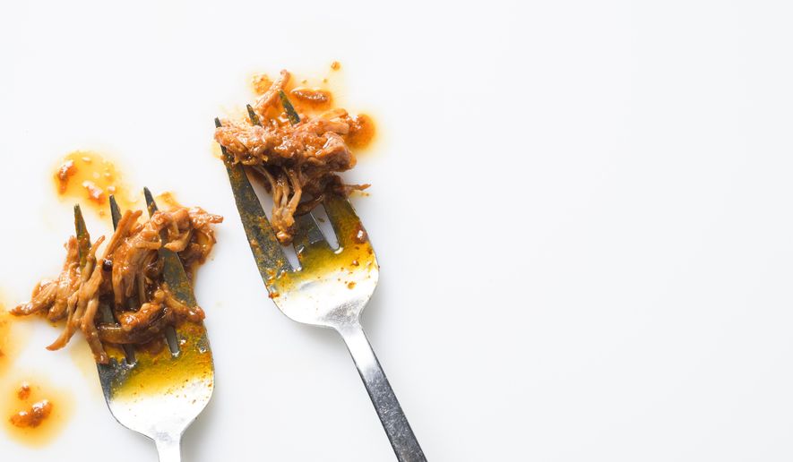 This image released by Milk Street shows a recipe for Miso-Gochujang Shredded Pork. (Milk Street via AP)