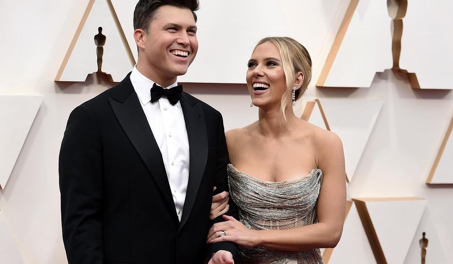 Colin Jost, left, and Scarlett Johansson arrive at the Oscars in Los Angeles on Feb. 9, 2020. The married couple, who once made comedy skits on “Saturday Night Live,&amp;quot; are reuniting onscreen for a new Super Bowl commercial. The 60-second ad launches Monday, Feb. 7, 2022, and will be televised during Super Bowl 56 on Feb. 13.  (Photo by Jordan Strauss/Invision/AP, File)