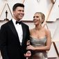 Colin Jost, left, and Scarlett Johansson arrive at the Oscars in Los Angeles on Feb. 9, 2020. The married couple, who once made comedy skits on “Saturday Night Live,&amp;quot; are reuniting onscreen for a new Super Bowl commercial. The 60-second ad launches Monday, Feb. 7, 2022, and will be televised during Super Bowl 56 on Feb. 13.  (Photo by Jordan Strauss/Invision/AP, File)