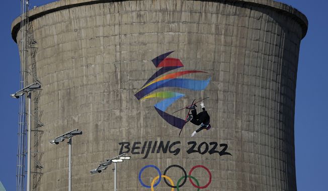Eileen Gu, of China, competes during the women&#x27;s freestyle skiing big air finals of the 2022 Winter Olympics, Tuesday, Feb. 8, 2022, in Beijing. (AP Photo/Jae C. Hong)