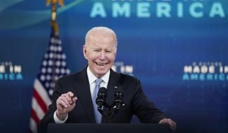 President Joe Biden speaks about domestic manufacturing, unions and electric vehicles in the South Court Auditorium in the Eisenhower Executive Office Building on the White House complex, Tuesday, Feb. 8, 2022, in Washington. (AP Photo/Alex Brandon)