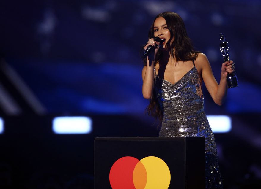 Olivia Rodrigo on stage after winning international song of the year at the Brit Awards 2022 in London Tuesday, Feb. 8, 2022. (Photo by Joel C Ryan/Invision/AP) ** FILE **