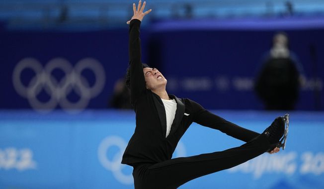 Nathan Chen, of the United States, competes during the men&#x27;s short program figure skating competition at the 2022 Winter Olympics, Tuesday, Feb. 8, 2022, in Beijing. (AP Photo/David J. Phillip)