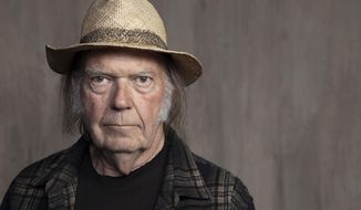Neil Young poses for a portrait at Lost Planet Editorial in Santa Monica, Calif. on Sept. 9, 2019. Young isn&#39;t satisfied with urging his fellow musicians to join him in taking their music off the streaming service Spotify. Now he wants company employees to quit their jobs before it &quot;eats up your soul.&quot; In a message on his website Monday, Feb. 7, 2022, Young said company CEO Daniel Ek is a bigger problem than popular podcaster Joe Rogan. (Photo by Rebecca Cabage/Invision/AP) **FILE**