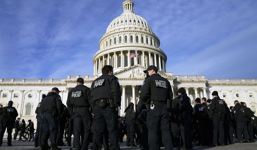 A large group of police arrives at the Capitol on Jan. 6, 2022, in Washington. U.S. Capitol Police officers are facing increasingly heated rhetoric from House Republicans as it tries to win back public confidence, including baseless allegations that the department&#x27;s officers are operating as politically driven spies. (AP Photo/Evan Vucci) **FILE**