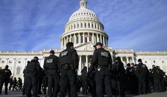 A large group of police arrives at the Capitol on Jan. 6, 2022, in Washington. U.S. Capitol Police officers are facing increasingly heated rhetoric from House Republicans as it tries to win back public confidence, including baseless allegations that the department&#39;s officers are operating as politically driven spies. (AP Photo/Evan Vucci) **FILE**