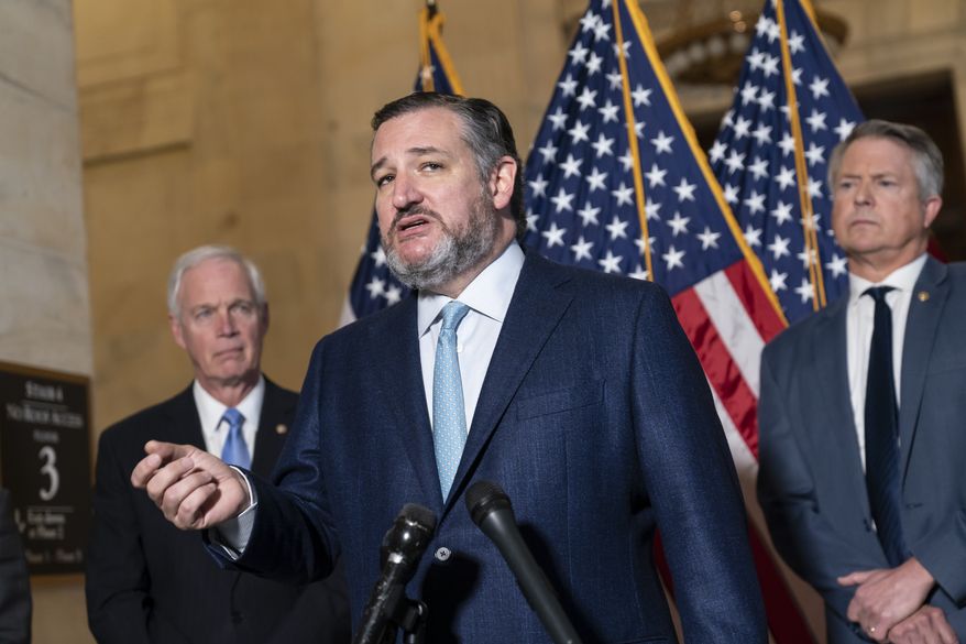 Sen. Ted Cruz, R-Texas, flanked by Sen. Ron Johnson, R-Wis., left, and Sen. Roger Marshall, R-Kan., talks about crime at the Capitol in Washington, Wednesday, Feb. 9, 2022. (AP Photo/J. Scott Applewhite)
