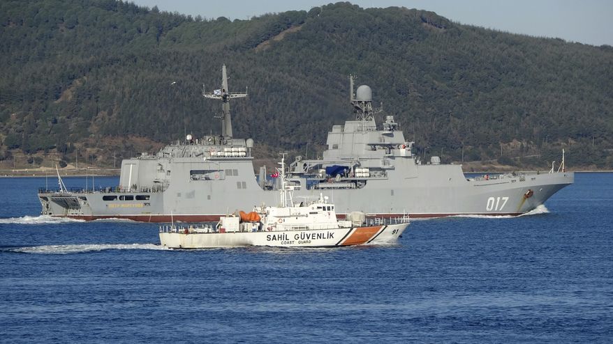 One of three Russian ships sails through the Dardanelles or Canakkale to cross the Bosphorus, Istanbul. on their way to the Black Sea, Wednesday, Feb. 9, 2022. Three more Russian navy ships are sailing through Turkey Wednesday en route to join military drills in the Black Sea. Russia's Defense Ministry said six large landing ships were moving from the Mediterranean to the Black Sea where they will take part in the exercises already underway. (IHA Photo via AP)